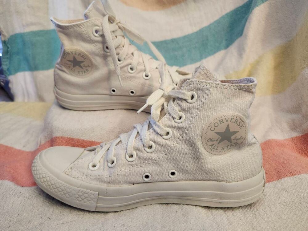 Converse Chuck Taylor All Star high-top sneakers featuring the brand's iconic ci